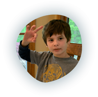 Photo of a boy making a Phonics in Motion hand motion